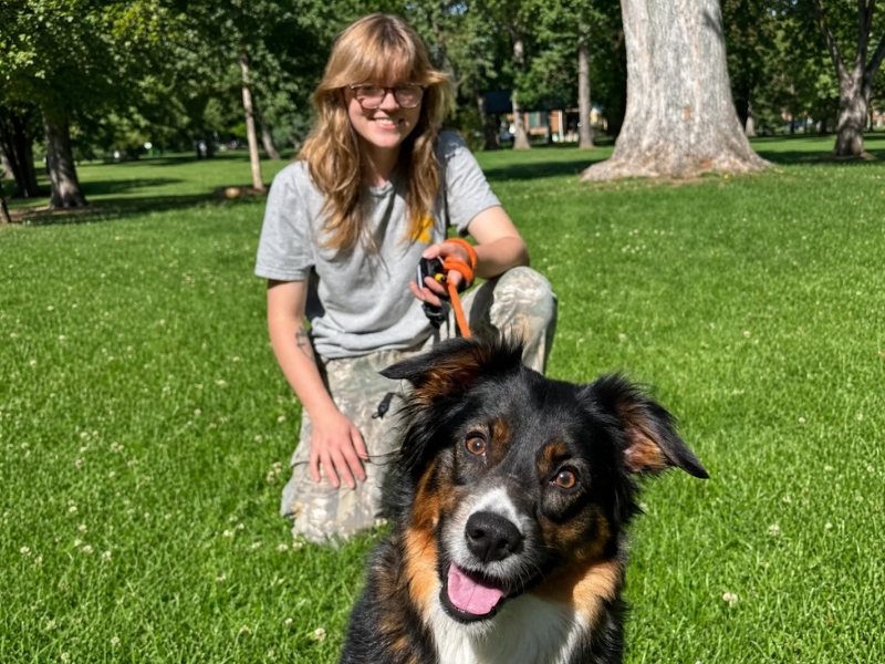 Graduate dog celebrating with their owner